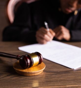 Female Judge signing documents