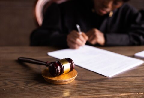 Female Judge signing documents